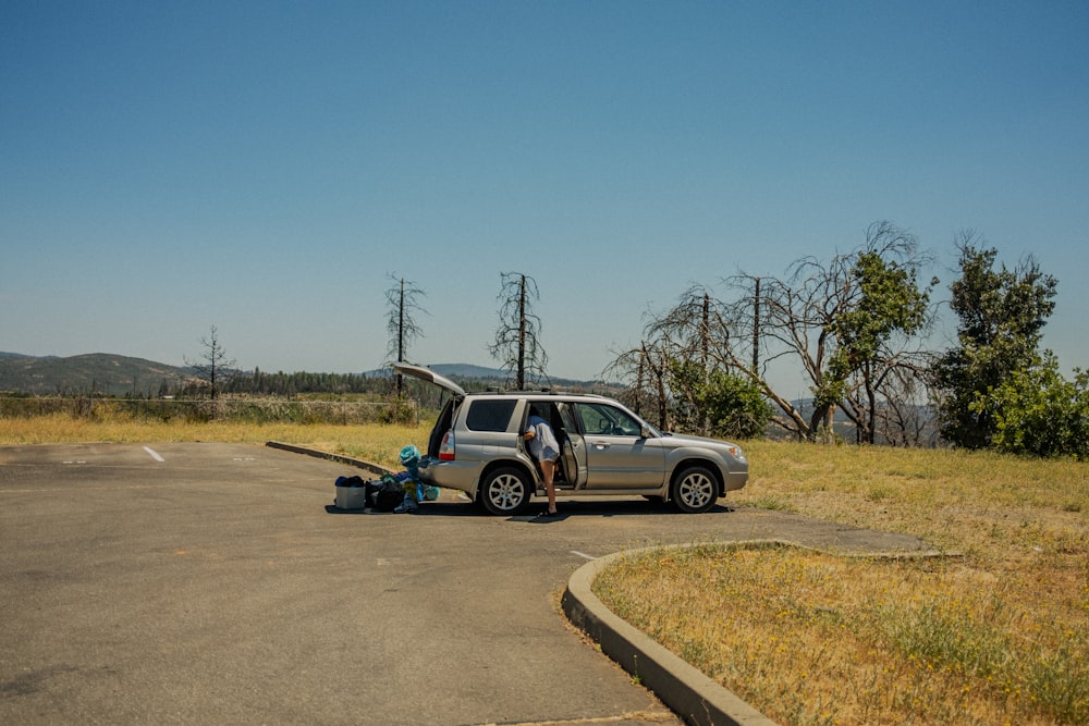 a person standing next to a car