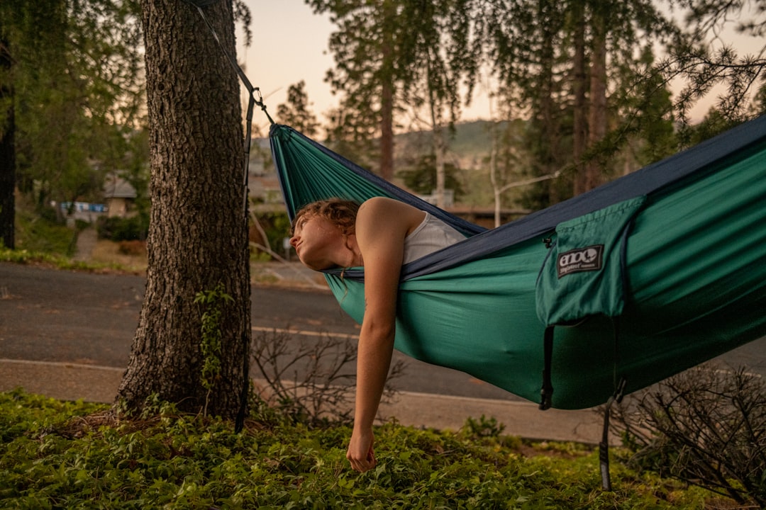 a boy lying in a tent,