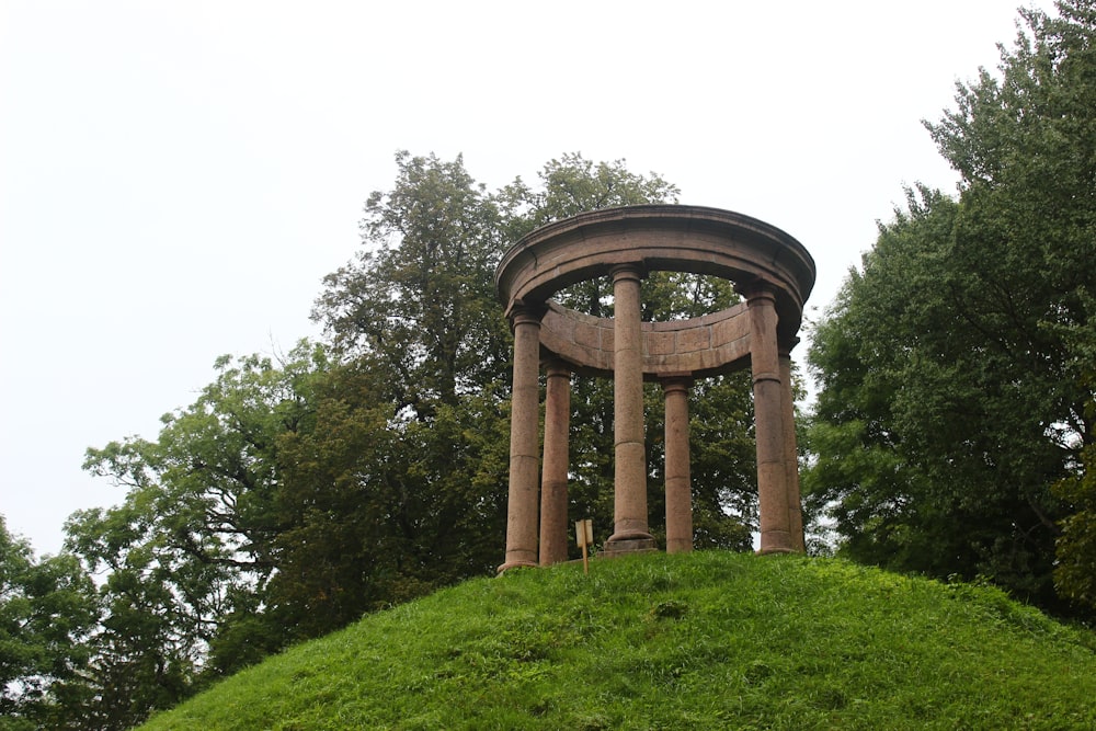 a structure outside with trees in the back