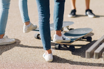 Casual athletes enjoying a sunny day in stylish footwear.