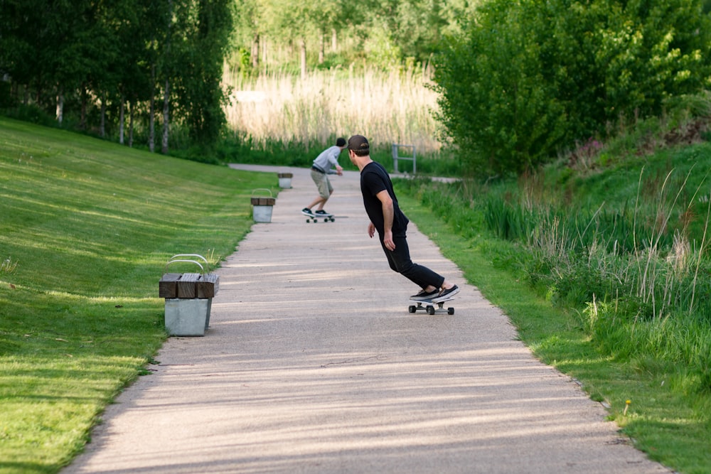 a young man riding a skateboard up the side of a road