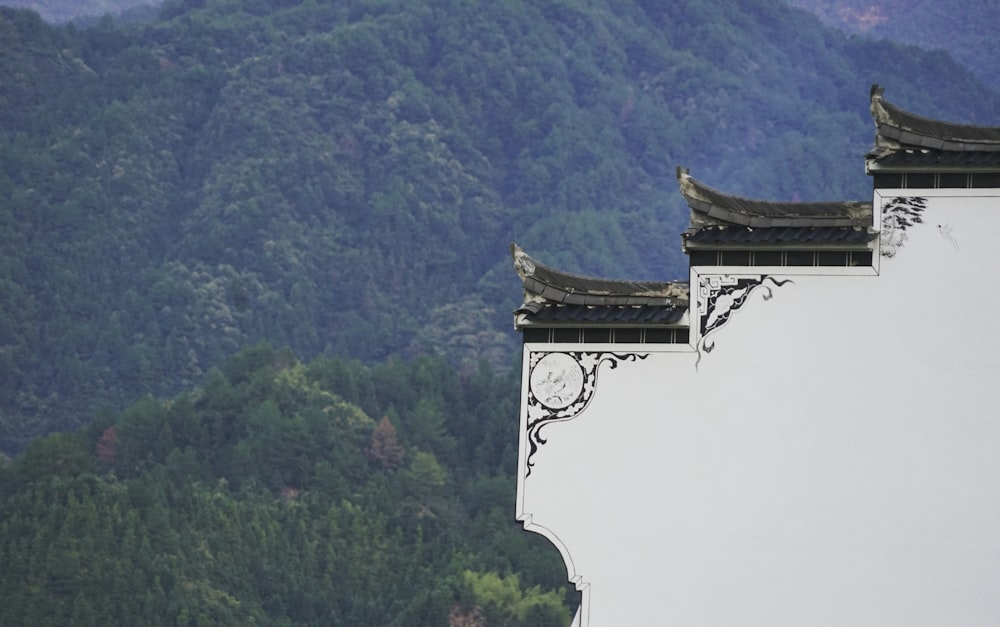 a building with a mountain in the background