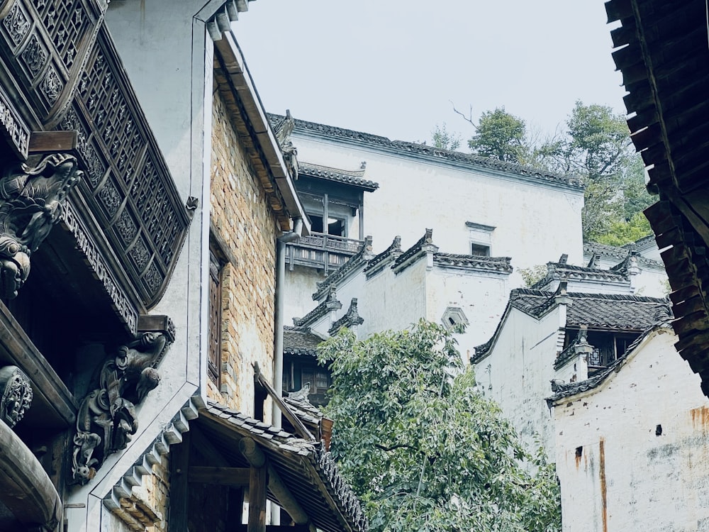 a group of buildings with trees