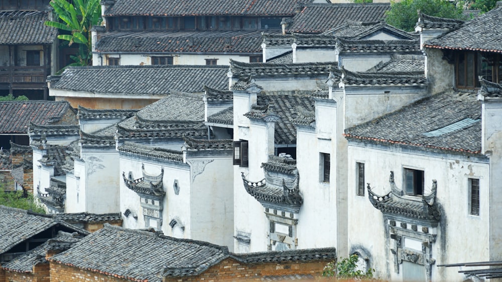 a group of buildings with roofs