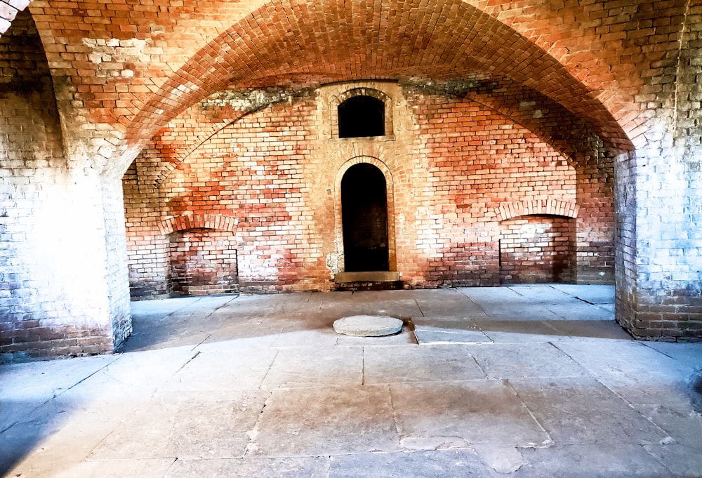 a brick archway with a door