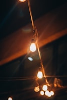 Warm LED string lights softly illuminating an evening patio.