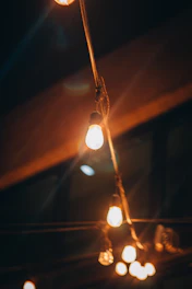 A set of colorful string lights glowing softly in a cozy nook.
