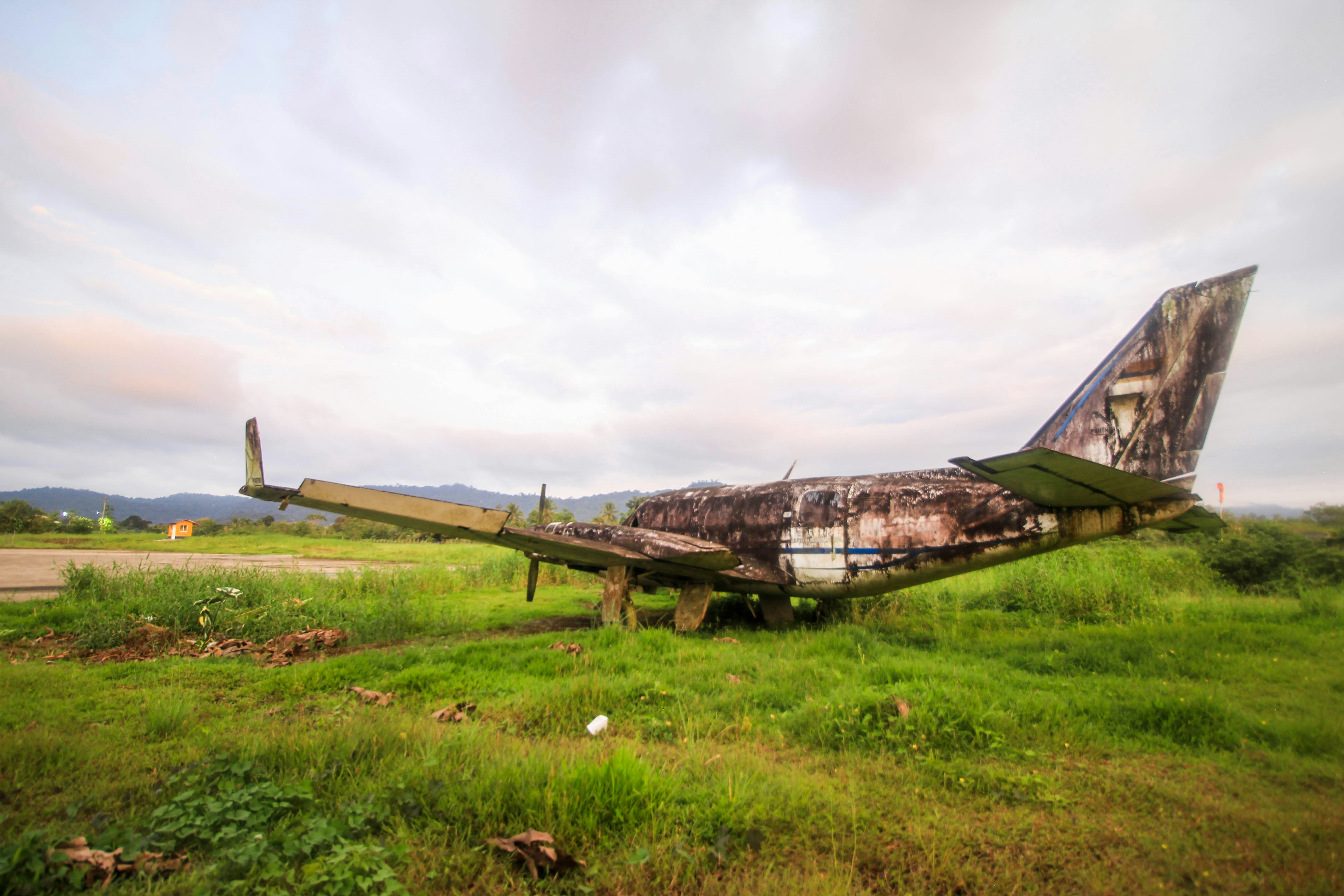 a plane on the ground, Abandoned nacro plane at the Nuqui, Colombia airport. - 2018