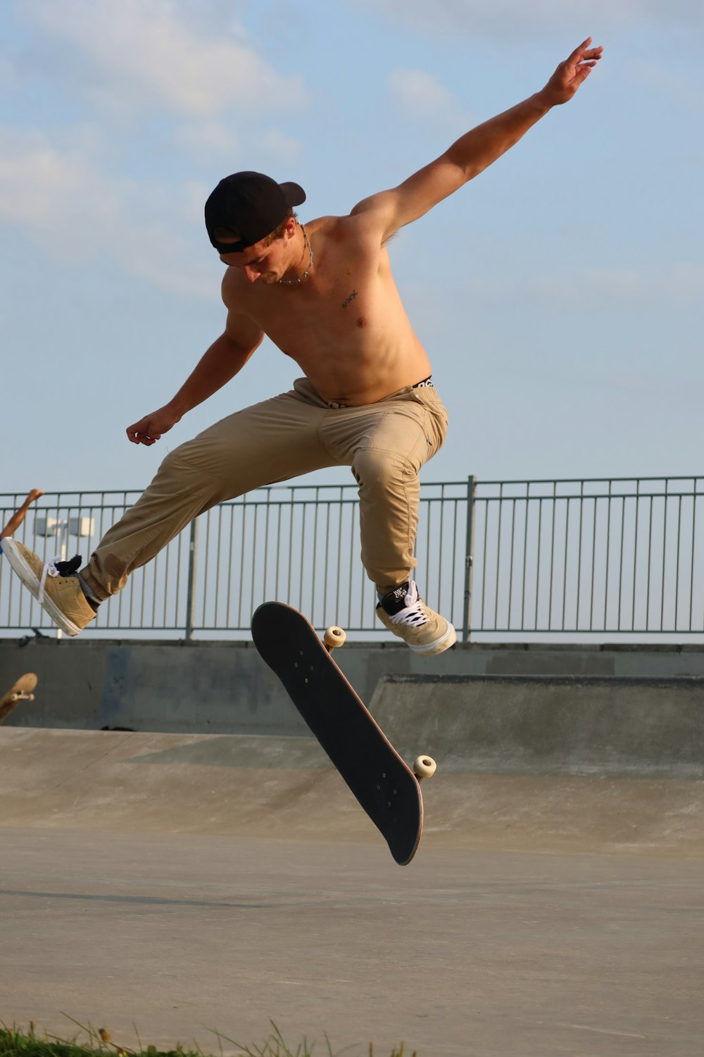a man jumping in the air with a skateboard