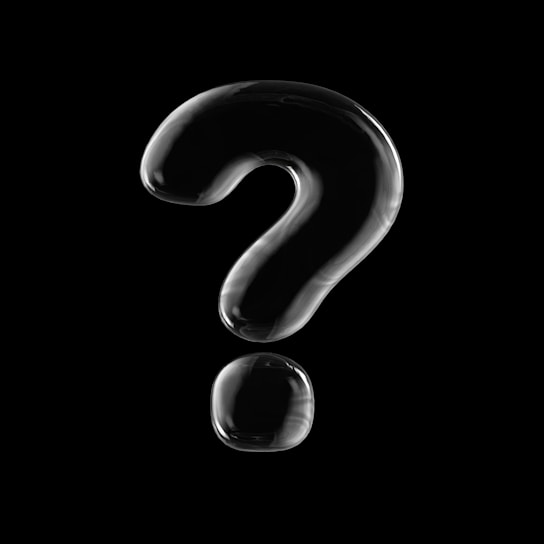 a silver ring with a black background