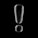 A large, translucent 3D glass exclamation mark is set against a solid black background. The mark consists of a tall, rounded pillar with a small spherical dot beneath it, reflecting light and appearing glossy.
