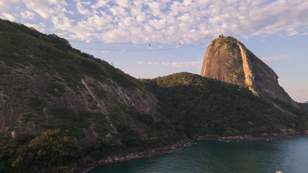 a body of water with hills around it