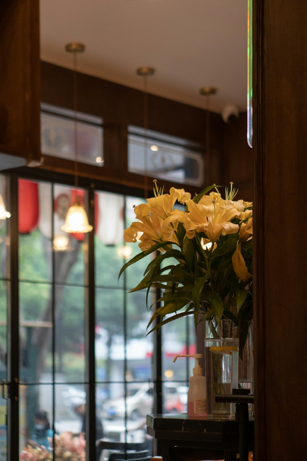 a vase of yellow flowers