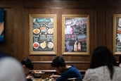 Happy diners enjoying their meals in a cozy restaurant atmosphere.