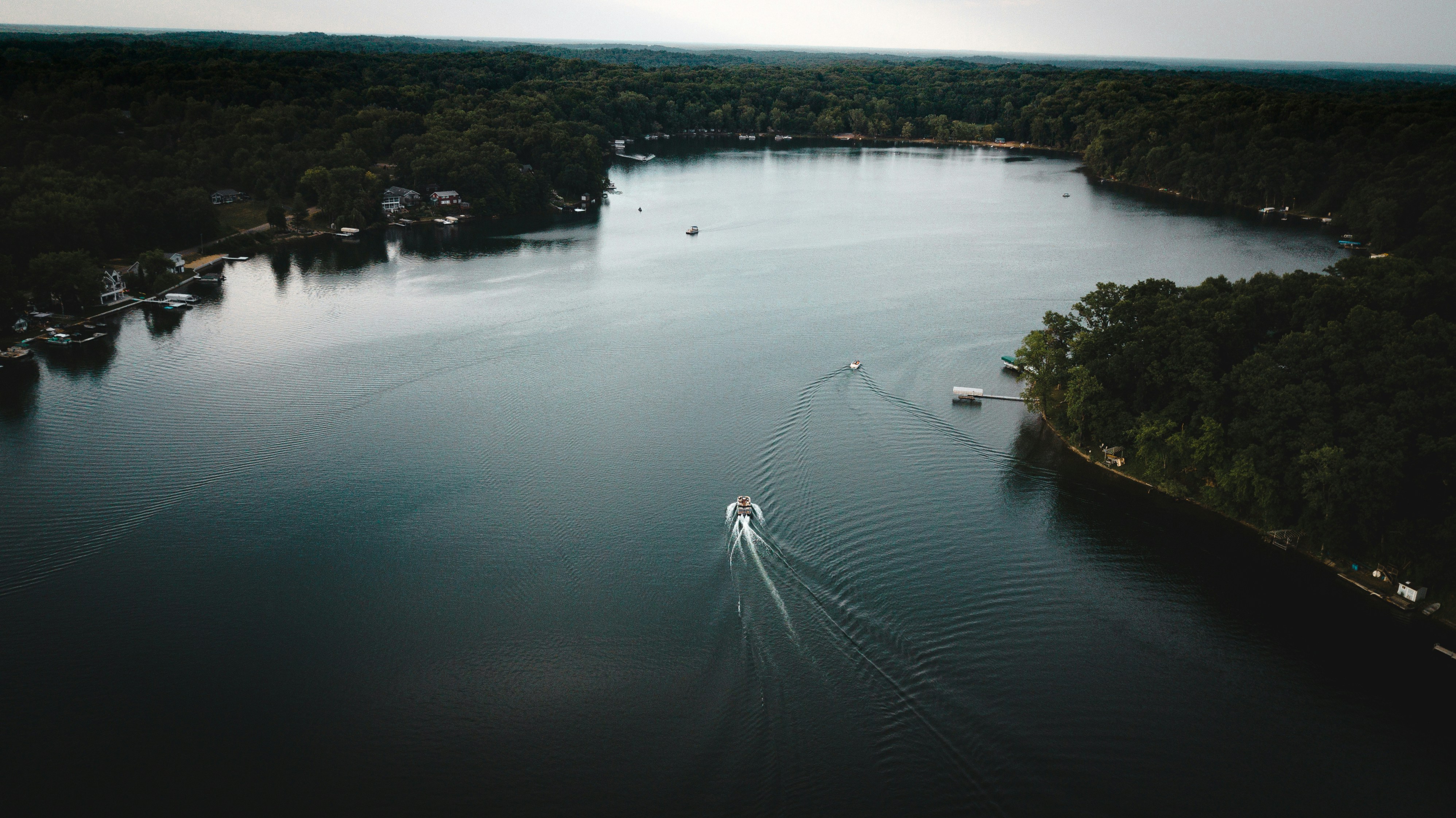 a body of water with trees around it
