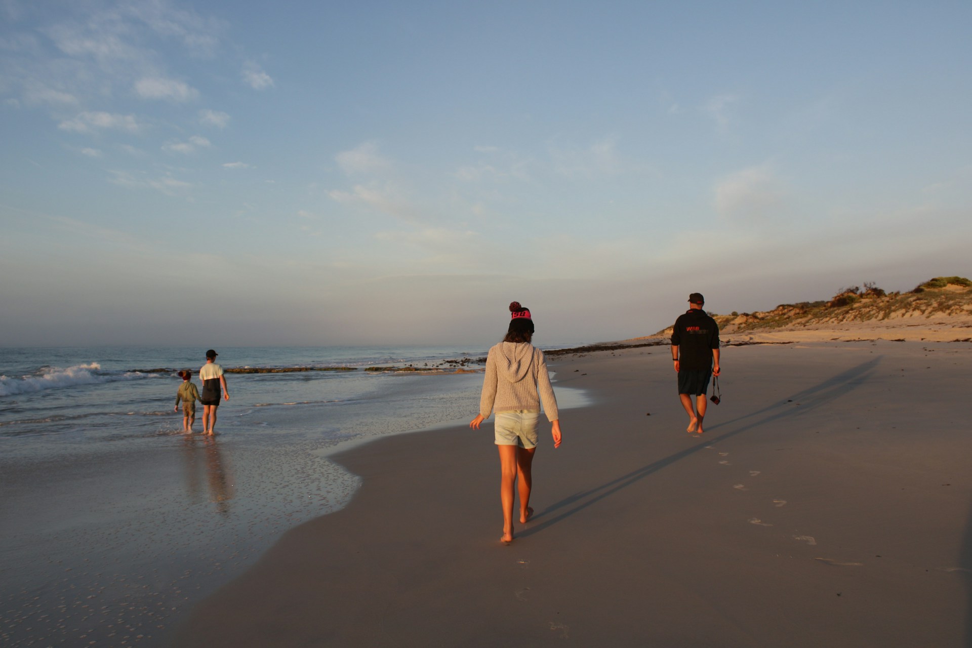 people walking on a beach