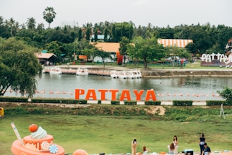 a body of water with a boat in it and people around it
