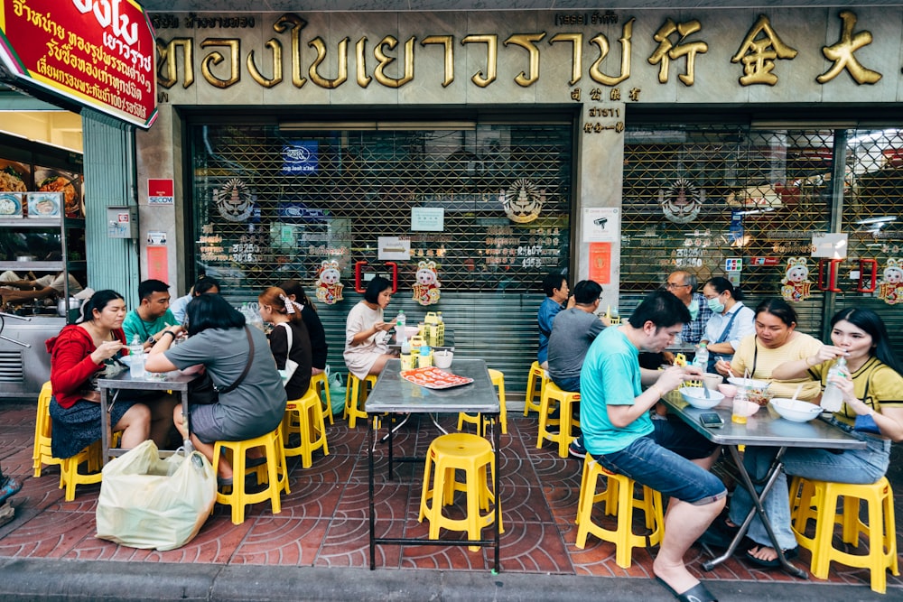 a group of people sitting at tables