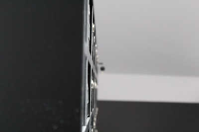 An abstract close-up of textured surfaces blending shadows and highlights in a minimalist composition.