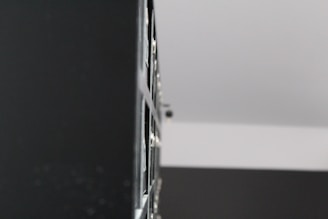 An abstract close-up of textured surfaces blending shadows and highlights in a minimalist composition.