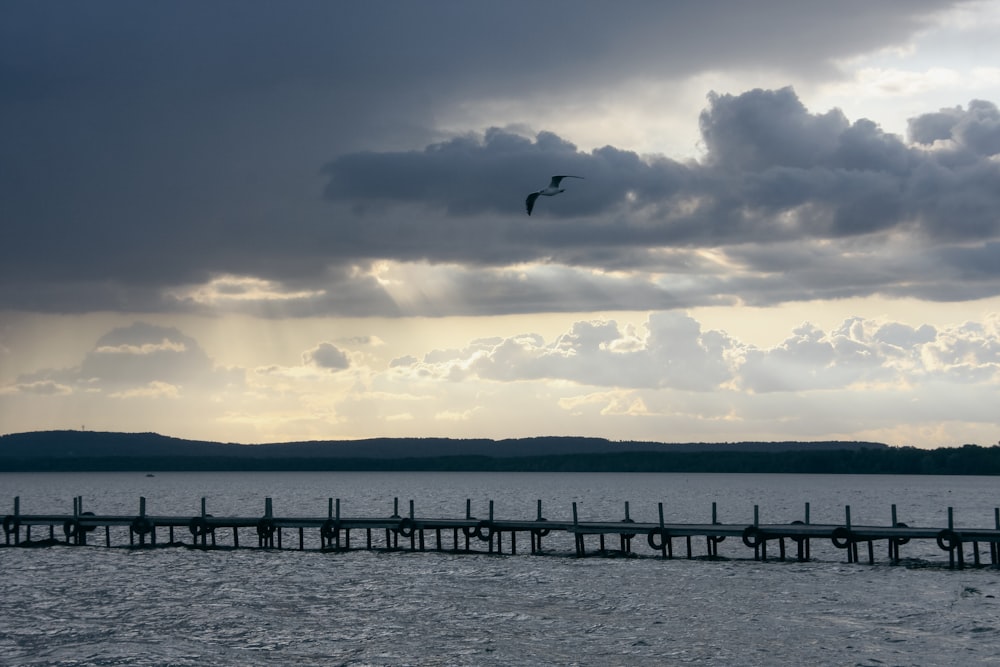 a group of clouds in the sky over a body of water