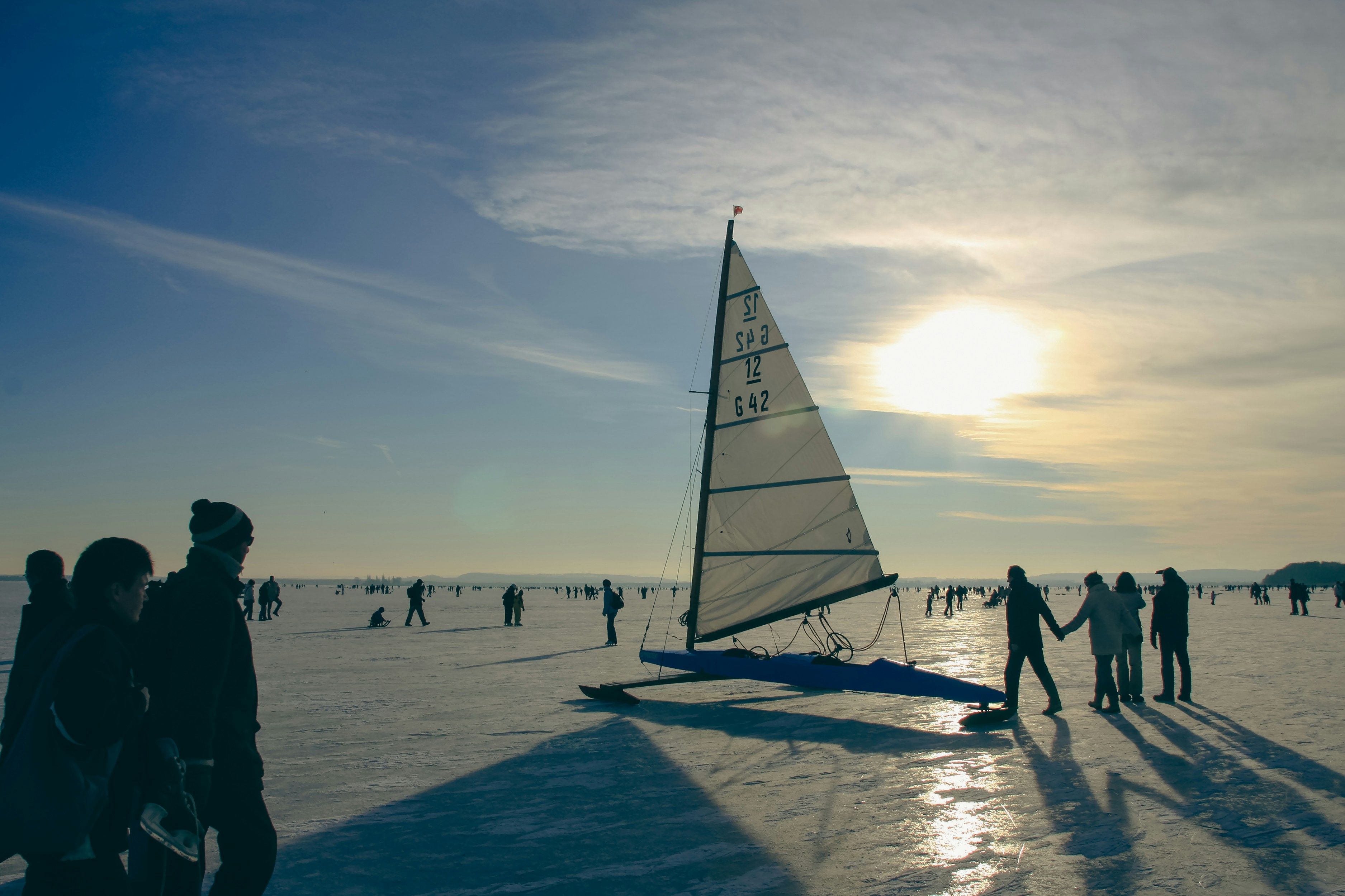 a group of people walking on a beach