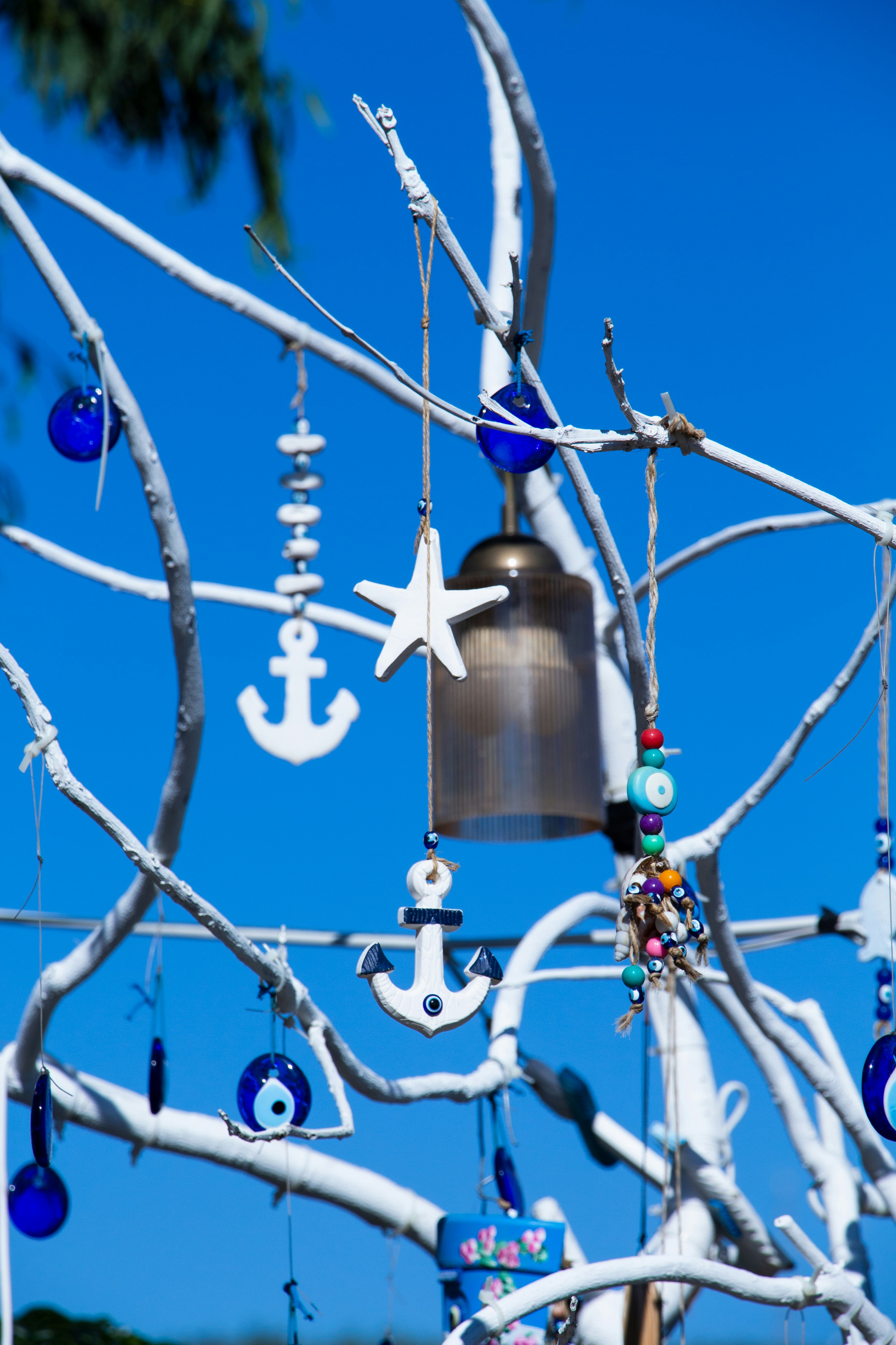 a large metal bell from a tree