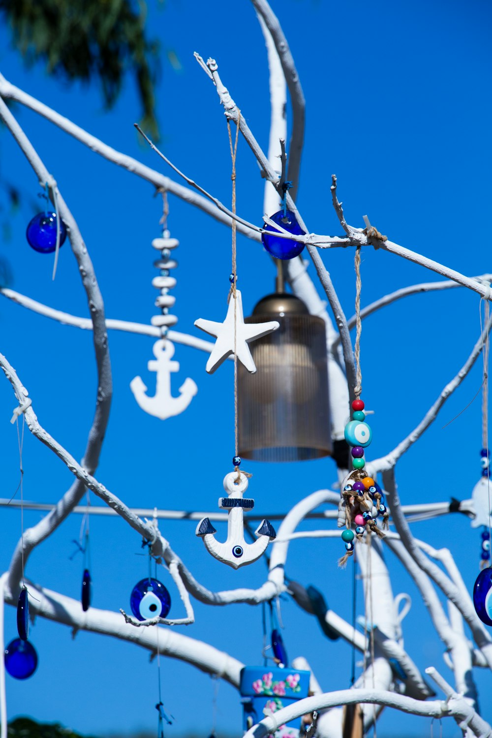 a large metal bell from a tree