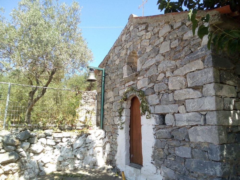 a stone building with a stone wall