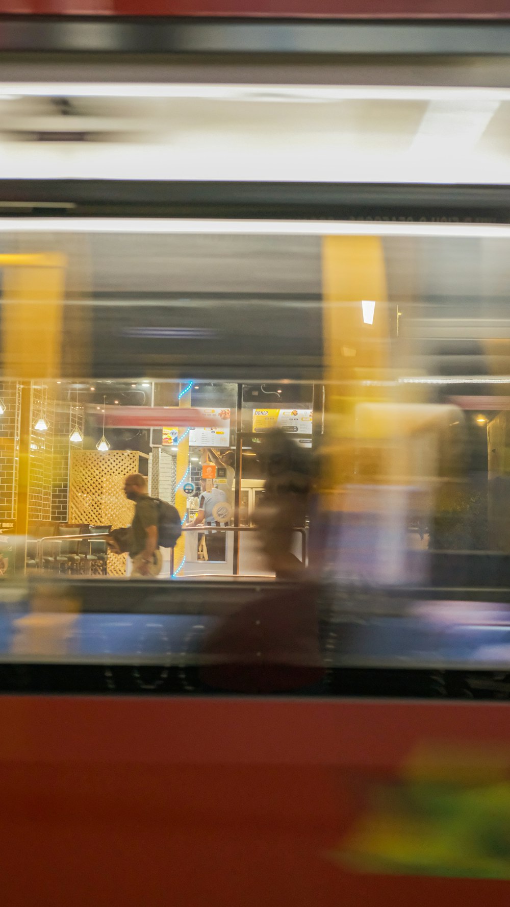 blurry image of people walking in a subway