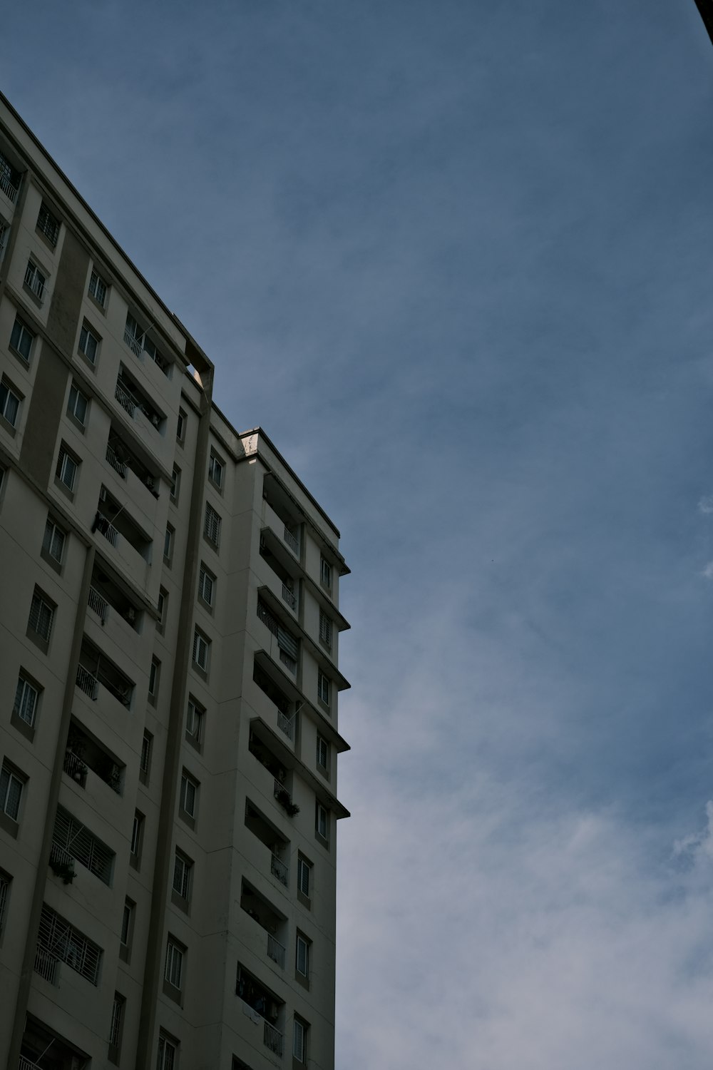 a tall building with a blue sky