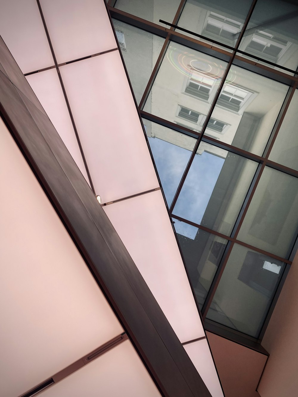 a window with a building in the background