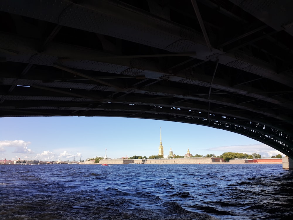 a body of water with a bridge over it