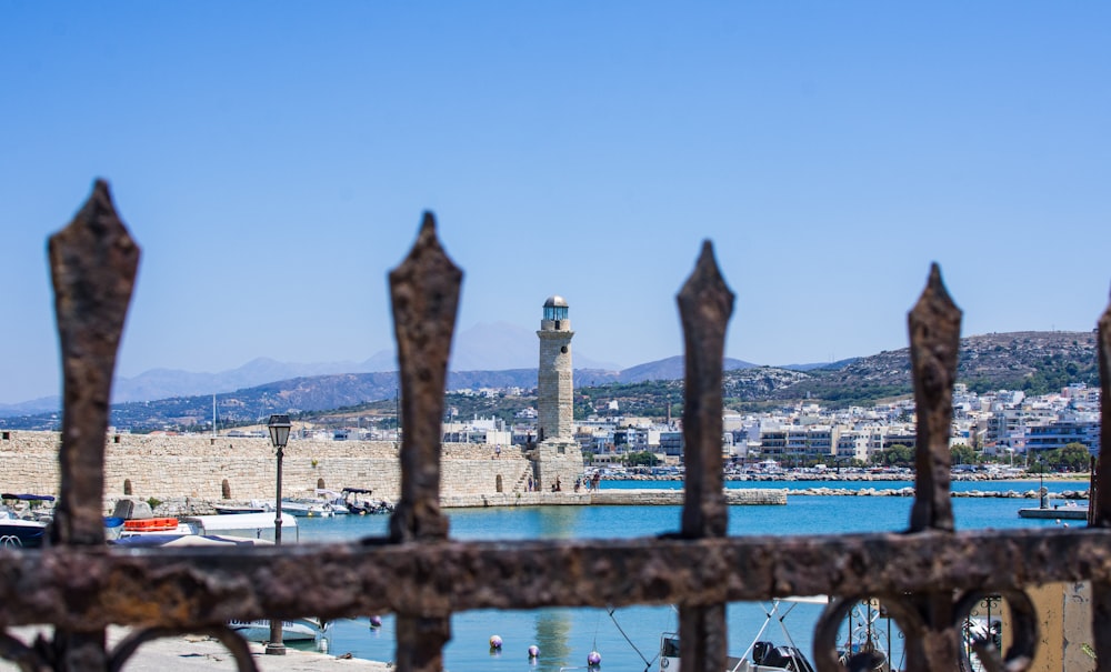 a city with a body of water in the background