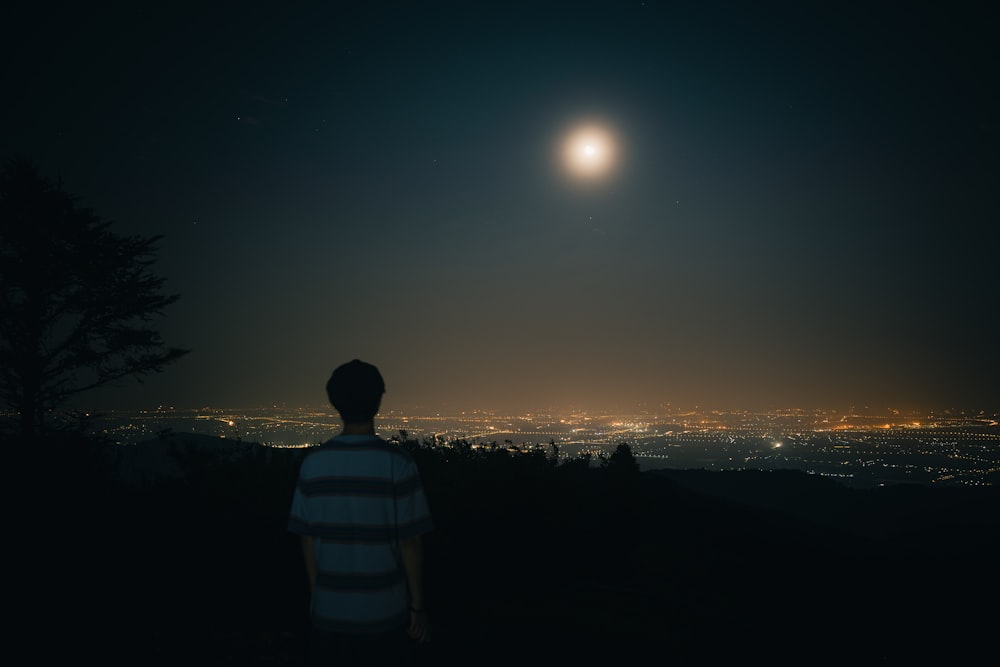 a person looking at the moon
