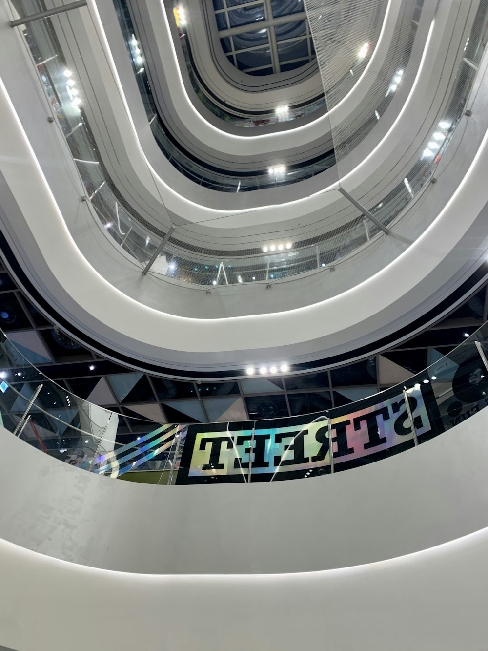 a large white building with a glass ceiling