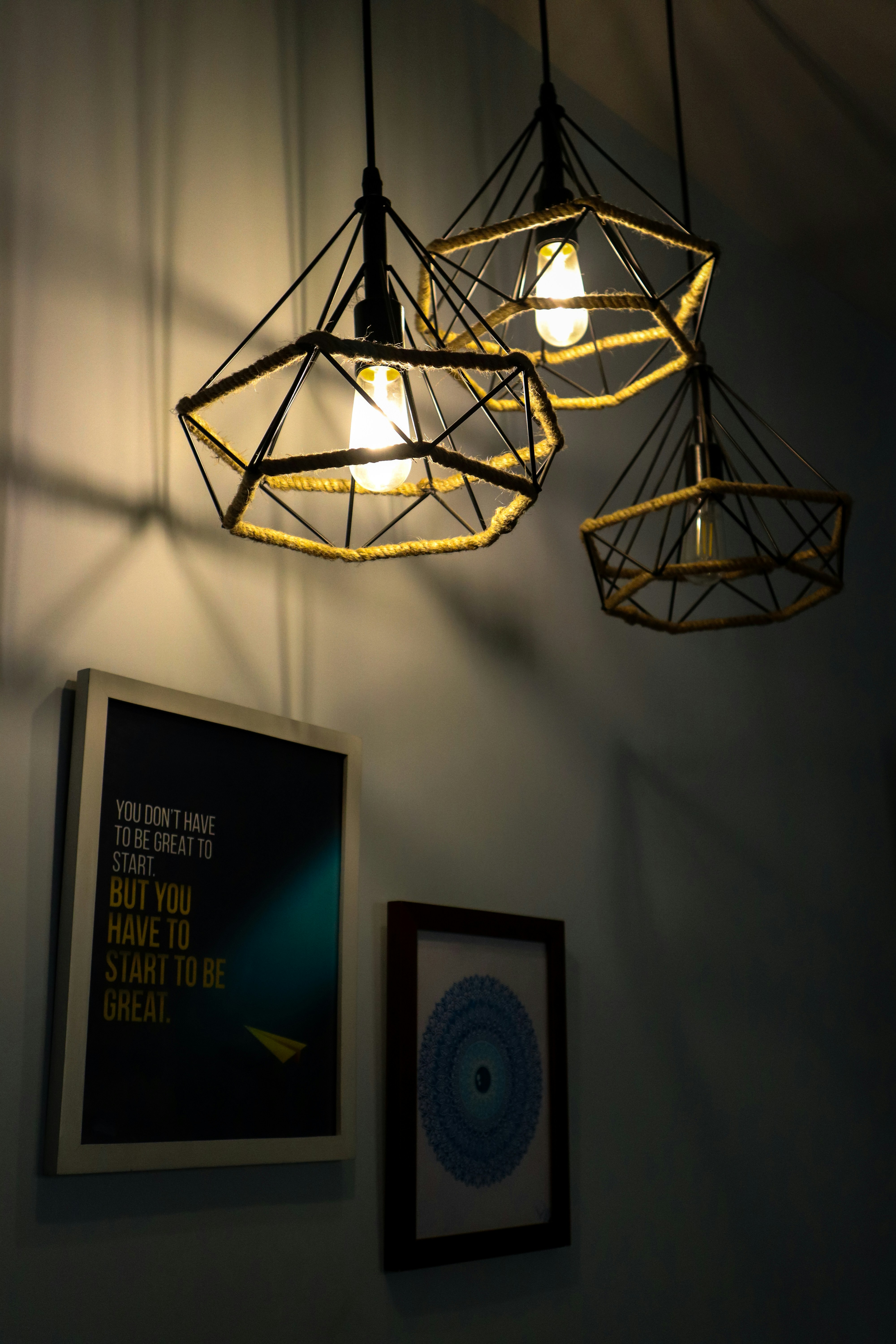 a light fixture with a picture of a man and a woman