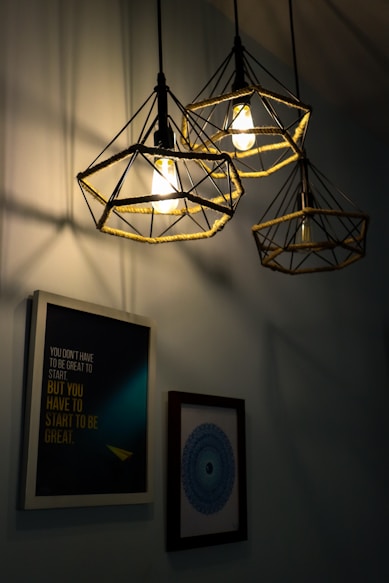 a light fixture with a picture of a man and a woman
