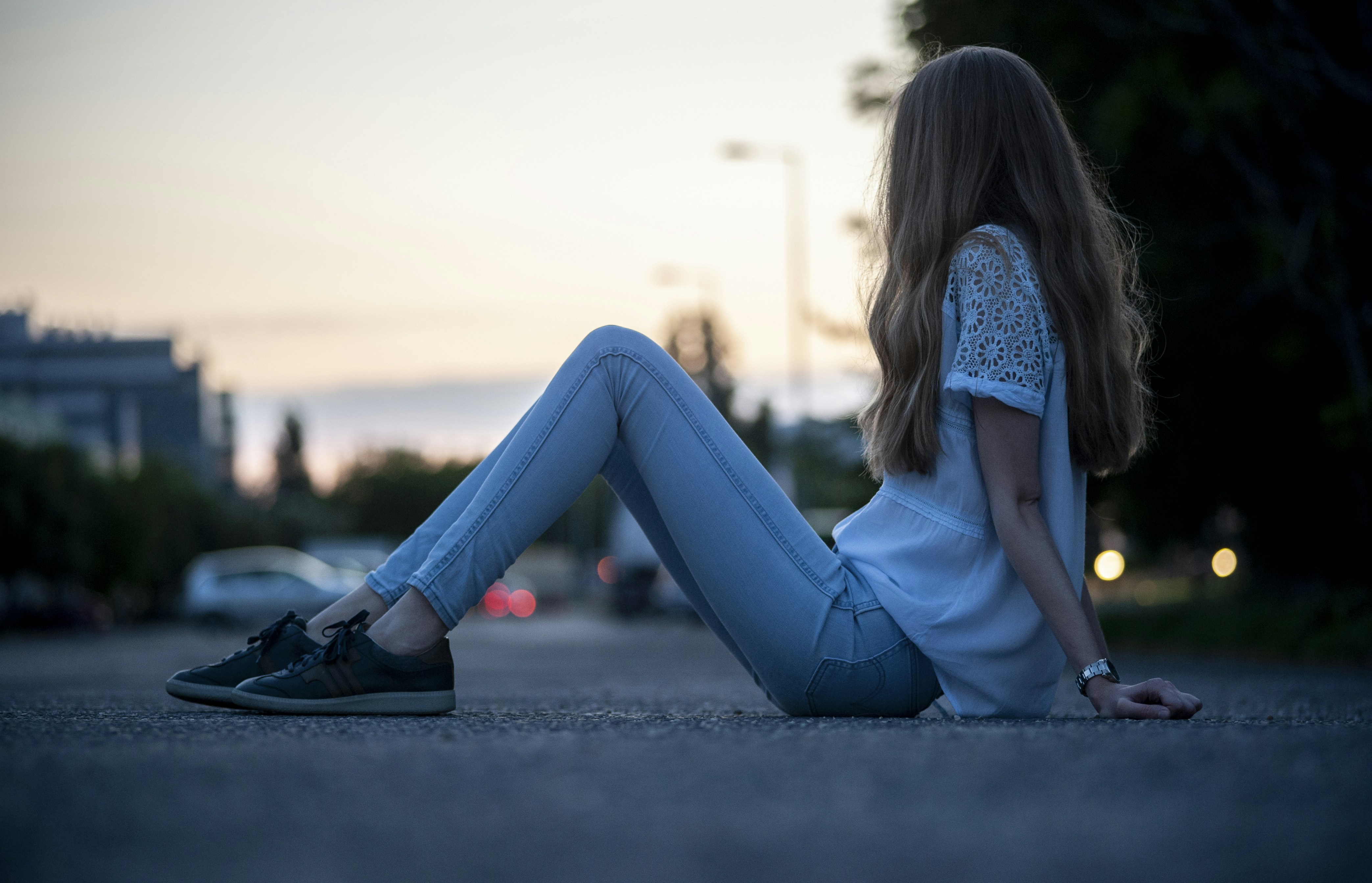a woman sitting on the ground