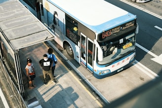 people boarding a bus