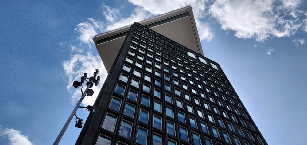 a tall building with a blue sky