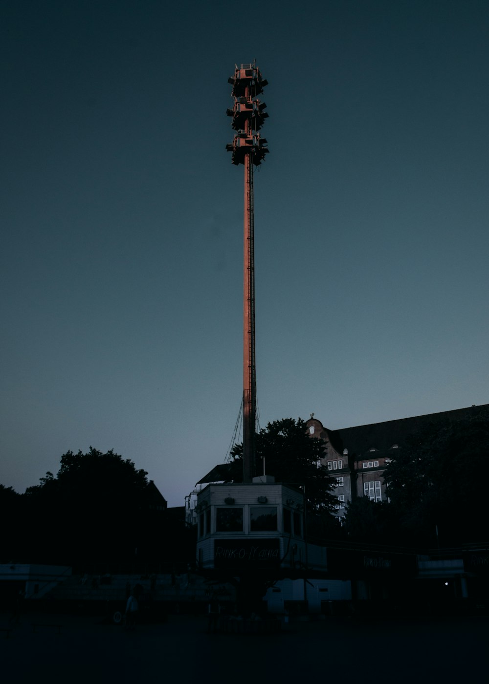 a tall tower with a building below