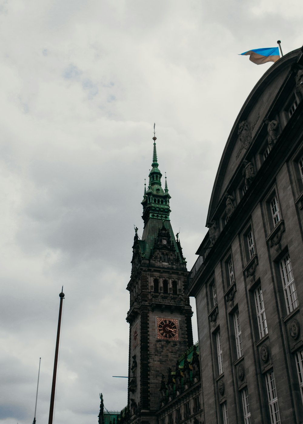 a clock tower with a flag