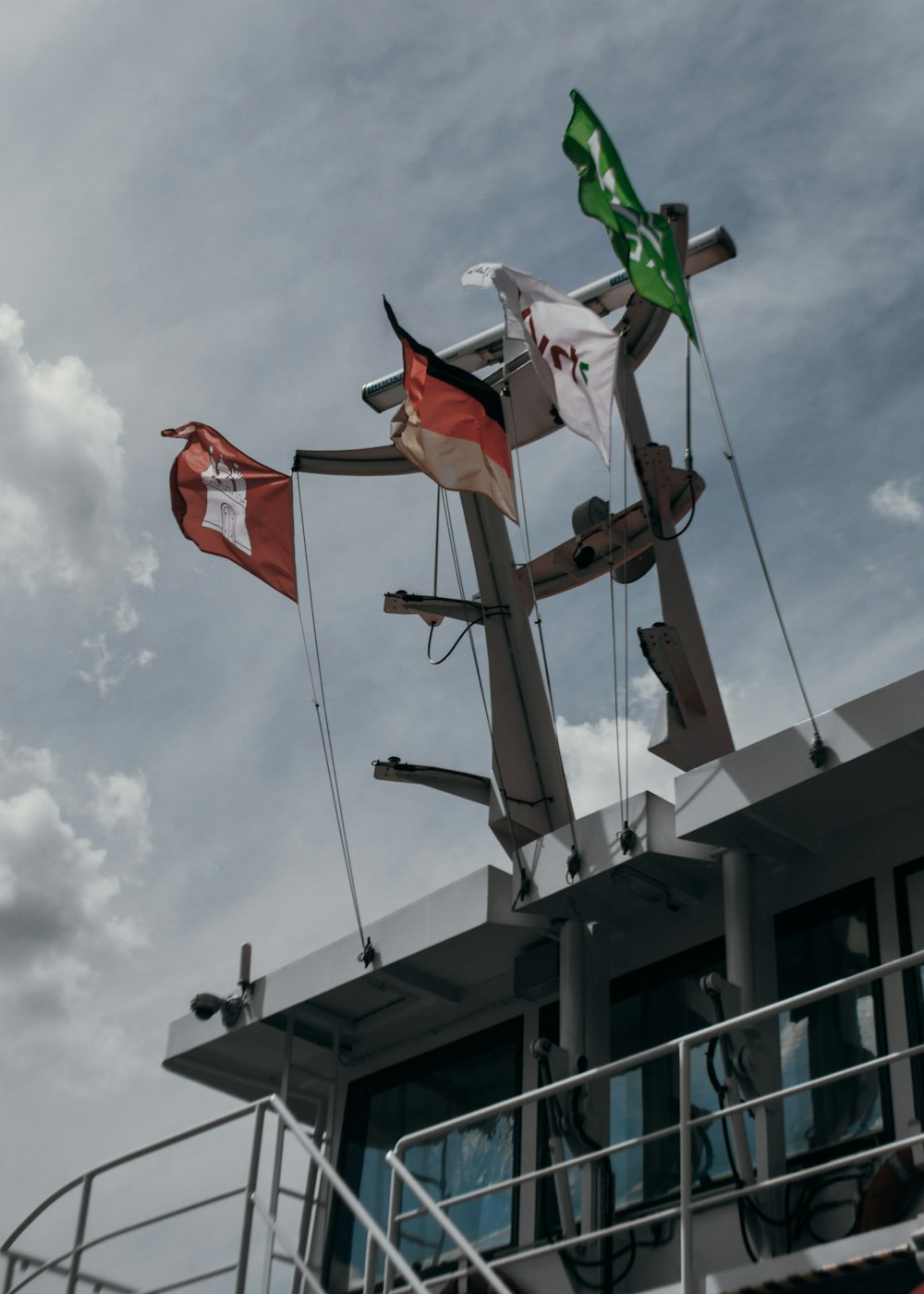 a group of flags on a boat