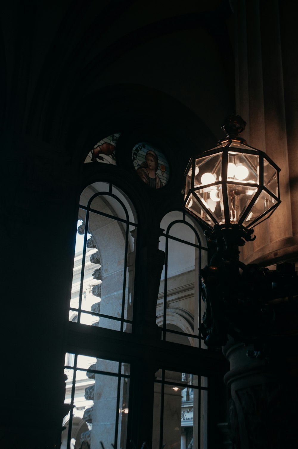 a lamp post with a couple of people on it