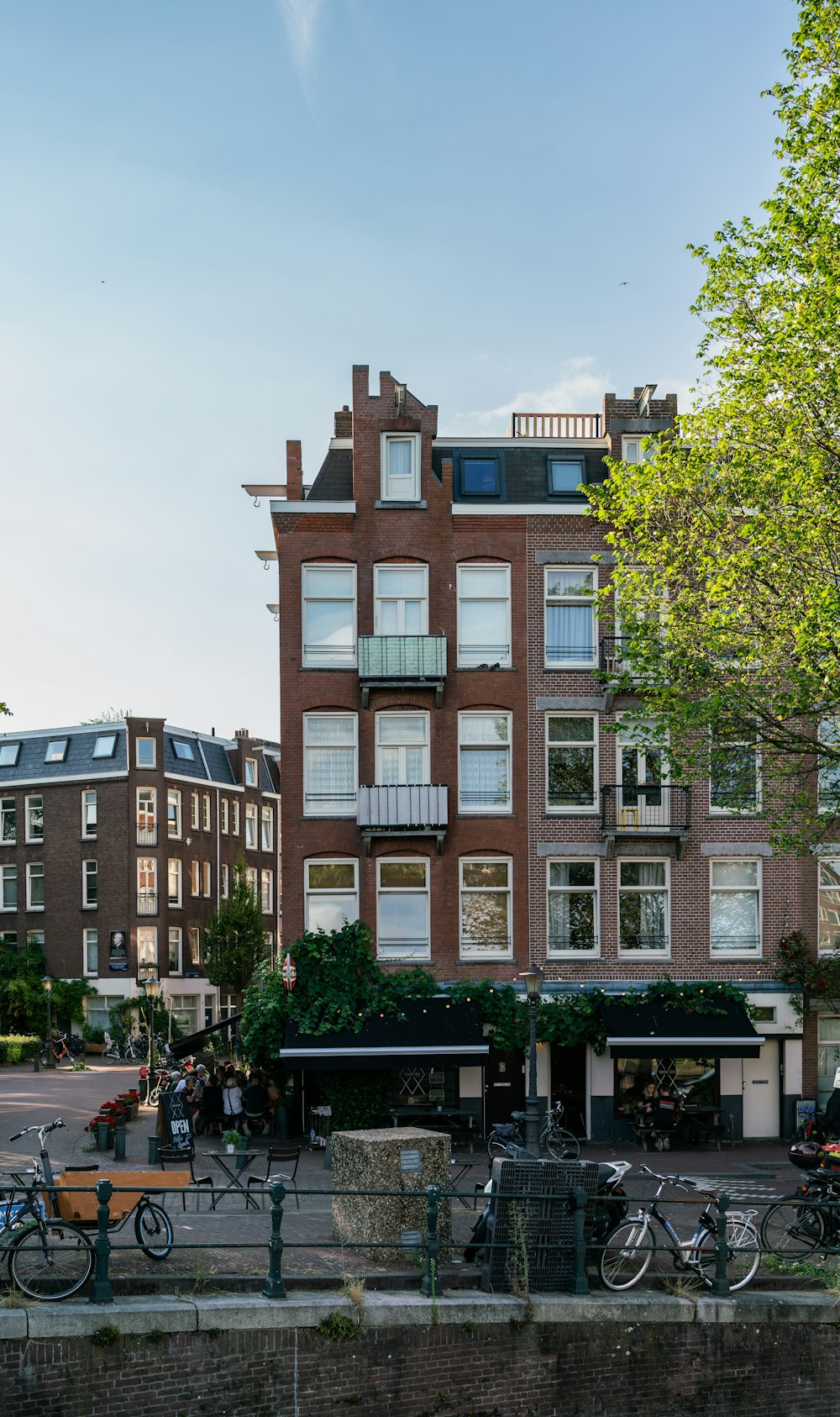 a brick building with bicycles parked in front of it