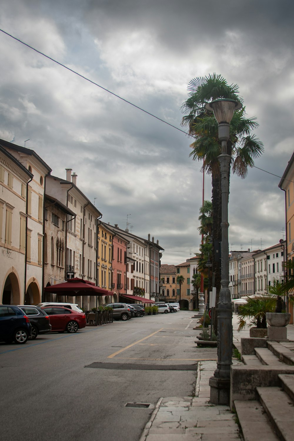 a street with cars and buildings on the side