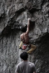 a man climbing a rock wall