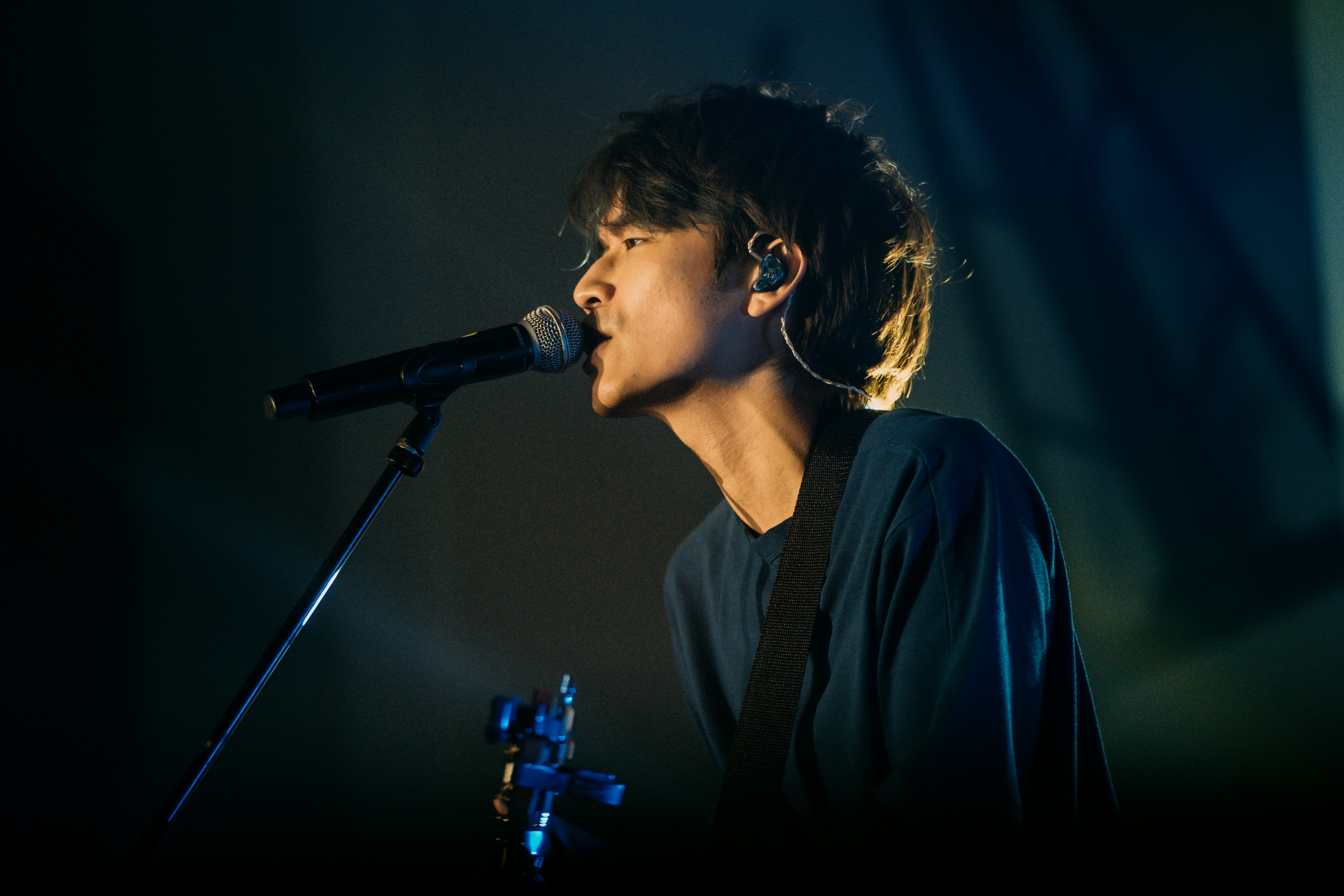 a person singing into a microphone