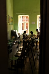 a group of people sitting at tables in a room